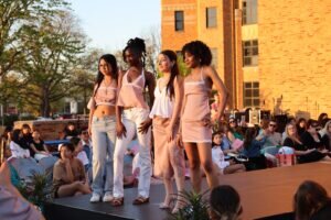 Works by Maine East Fashion Classes shown on 4 people posing