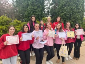 Maine South Eyrie Students holding awards