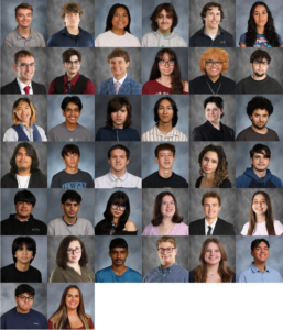 A group of 33 high school students and staff pose for individual yearbook portraits, each smiling or looking at the camera, set against a gray background.